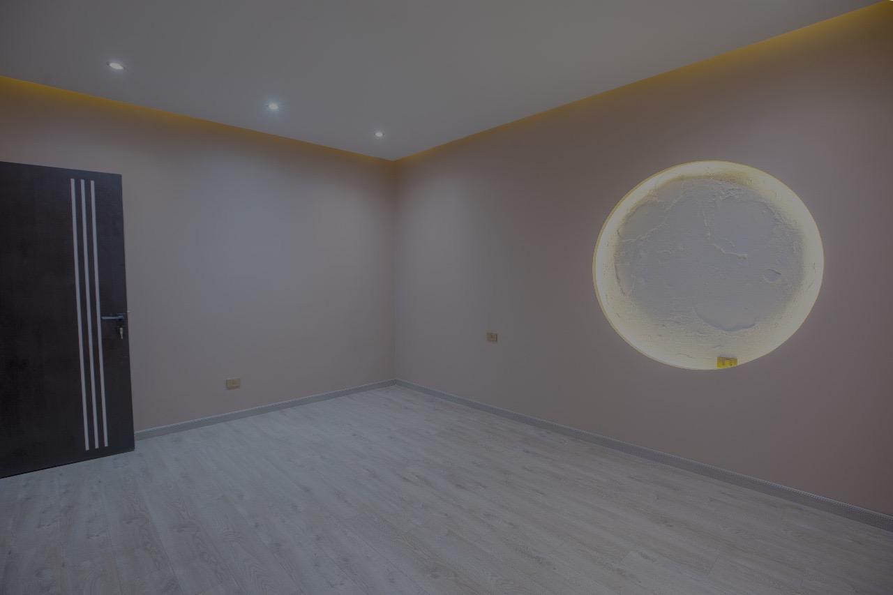 Minimalist Bedroom with Circular Lighting